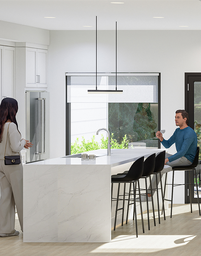 Image of Willow Loft Kitchen Showing Two Adults Talking While One Drinks Coffee