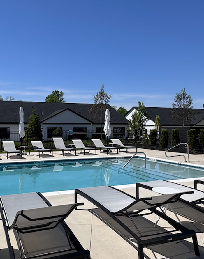 Image of the pool, showing the steps into the shallow end, with the lounge chairs flanking each side