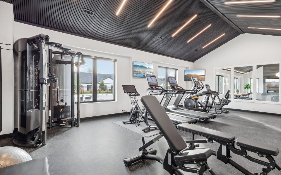 Weight Room View Showing Weight Machines and Cardio Equipment