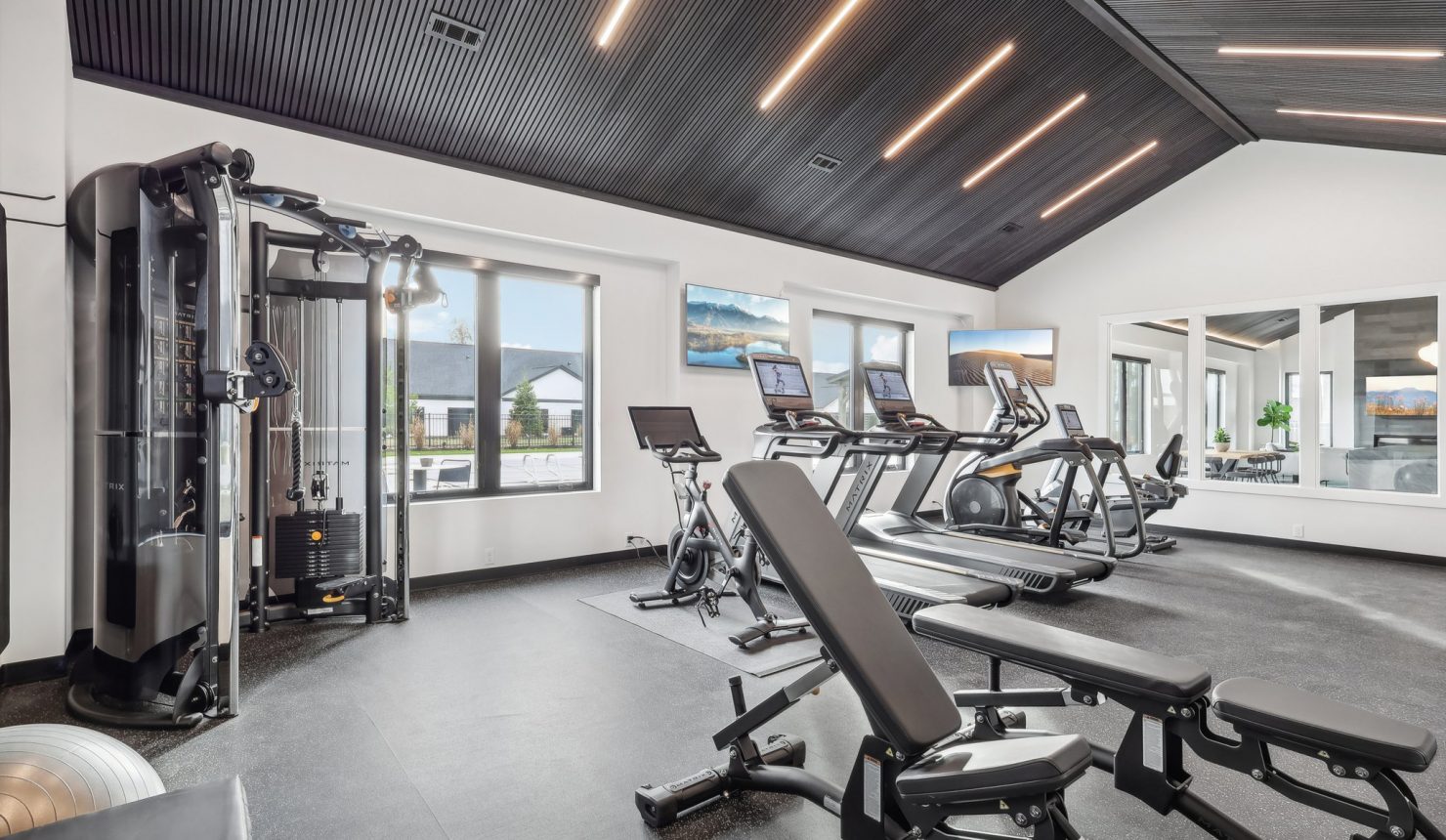 Weight Room View Showing Weight Machines and Cardio Equipment