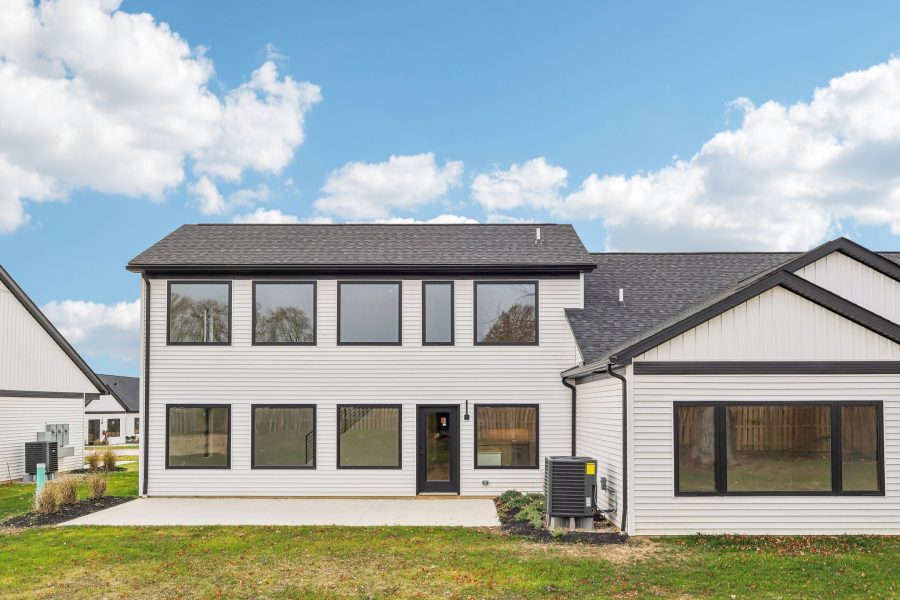 Back of Willow Unit Showing Rows of Windows in the Main Living Area, Plus Patio